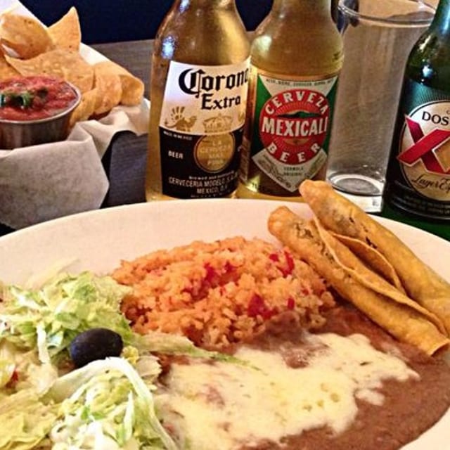 A. Green Enchilada with Two Rolled Tacos.